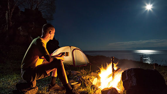 A family enjoying their time at campsite 