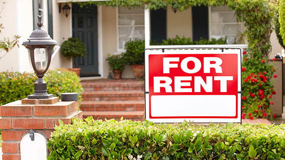 A for rent sign in front of home