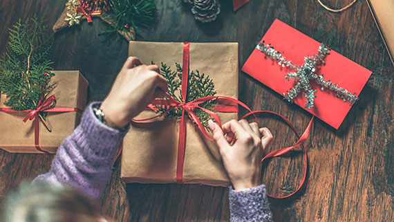 A person wrapping a present
