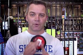 A man holding a spool of fishing line