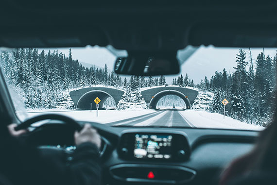 View from inside a car on snow covered roads